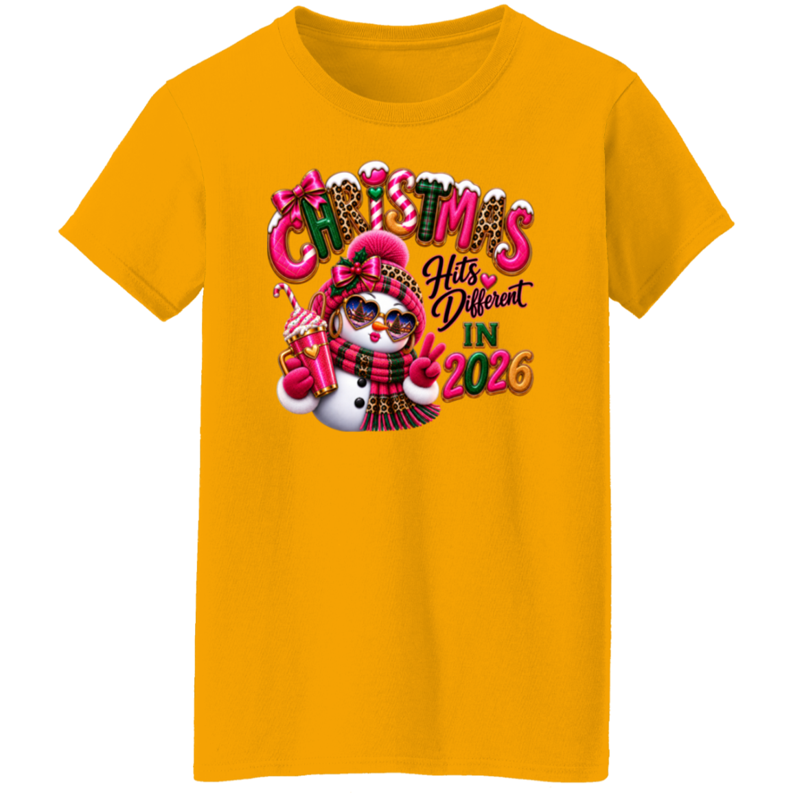 Gold ladies tee with Christmas Hits Different in 2026 snowman design