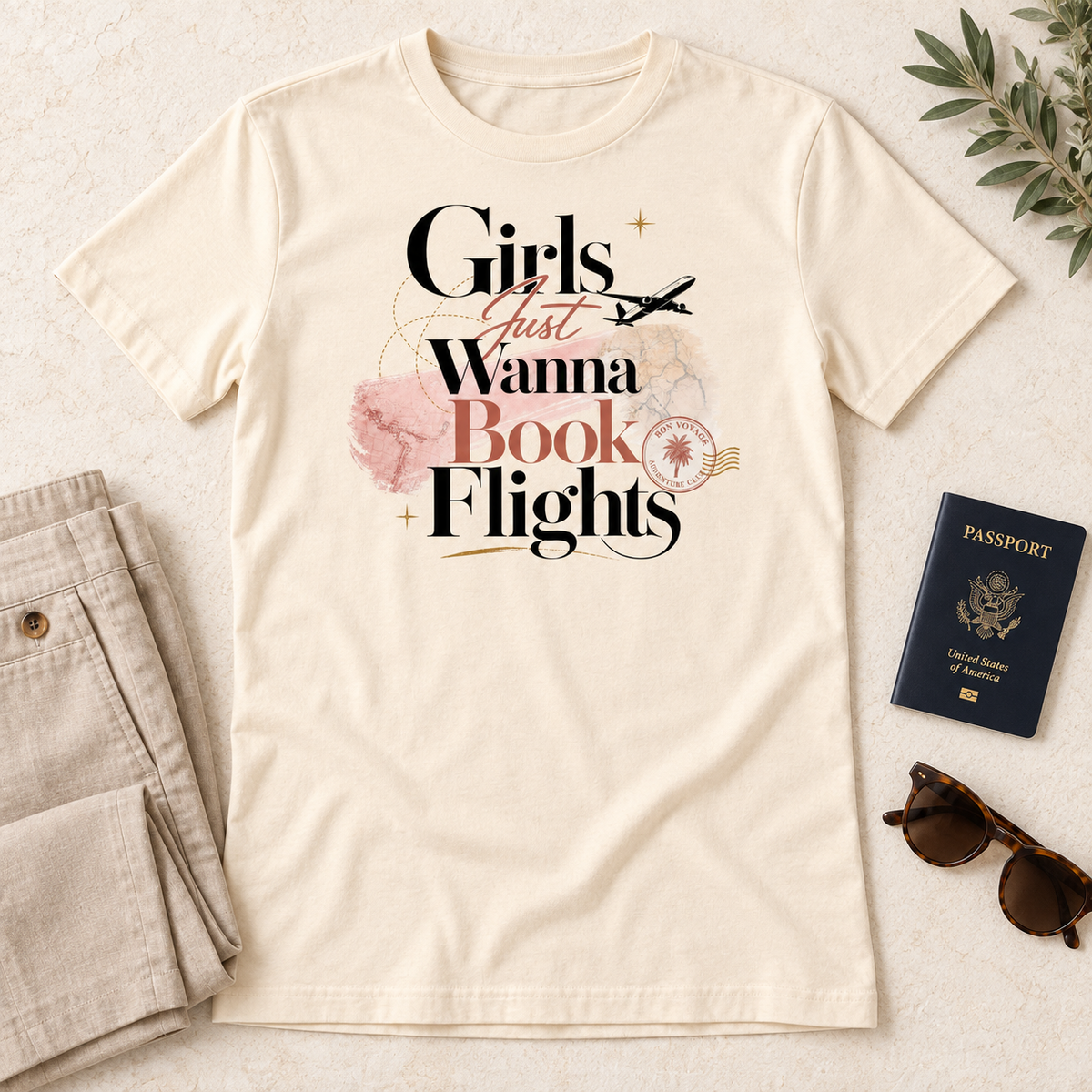 Girls Just Wanna Book Flights Blush and Black tee in natural, flat-lay mockup